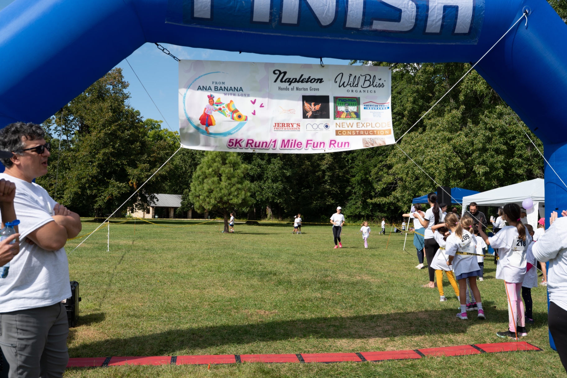 Sponsor banner on the finish arch at the 5K Run and 1 Mile Fun Run
