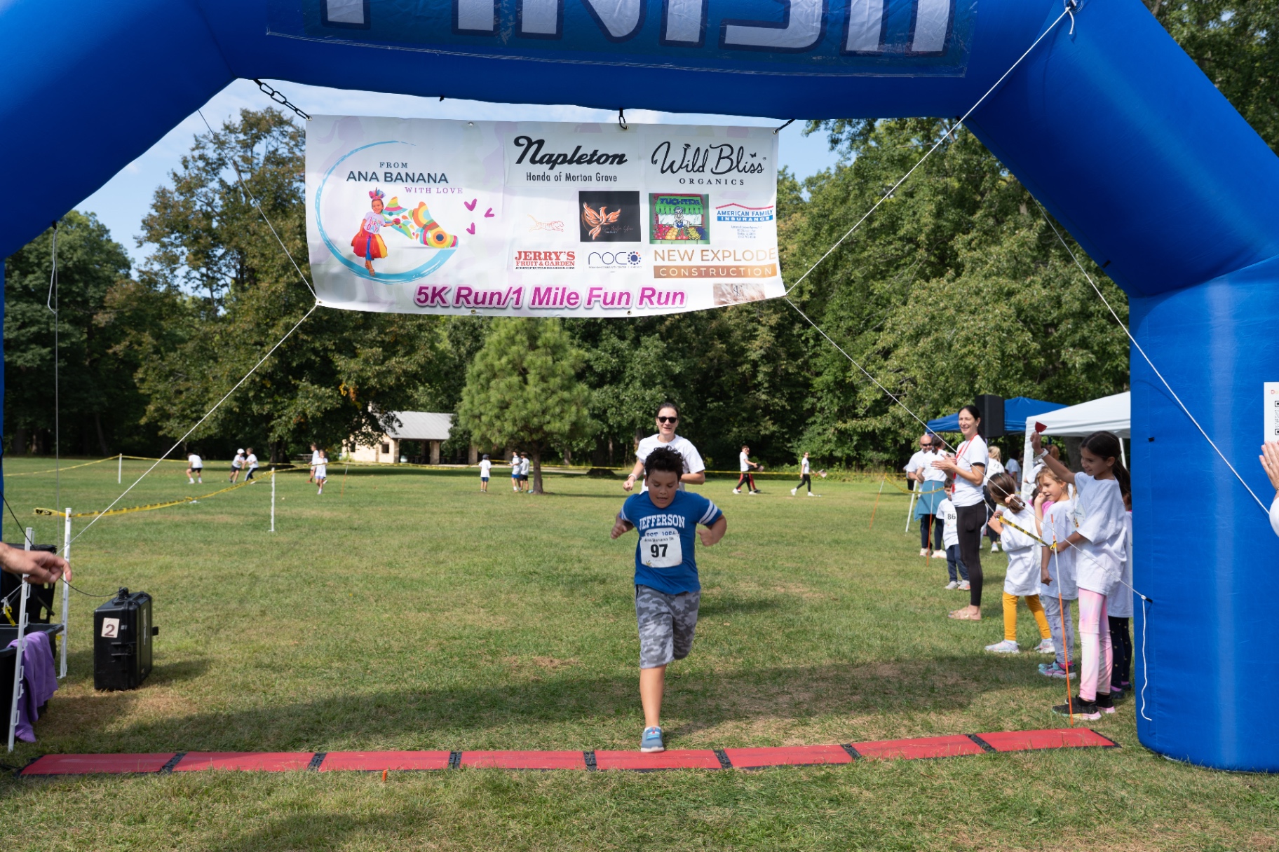 Young runner crossing the finish line