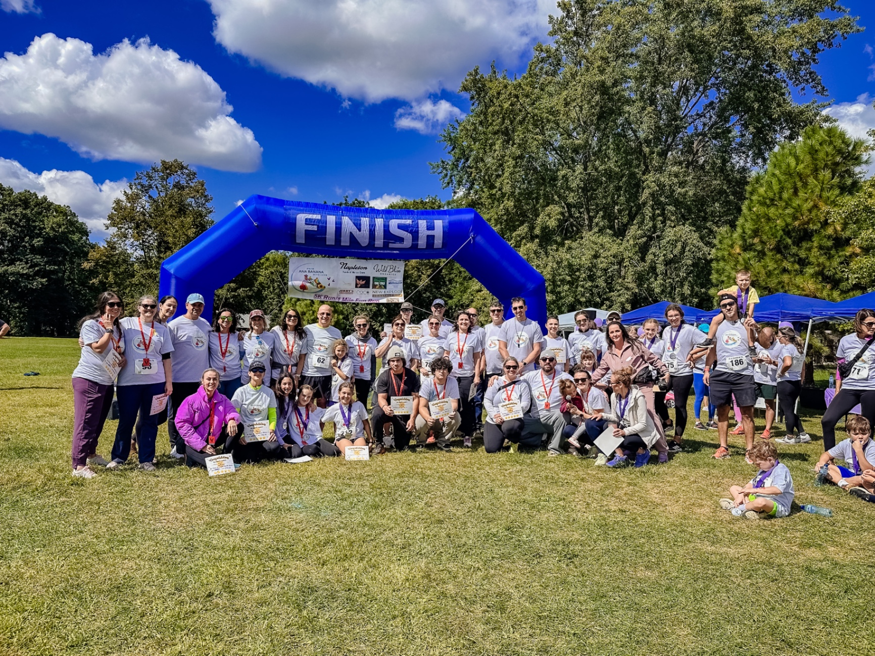 Runners and families gathered under the finish arch